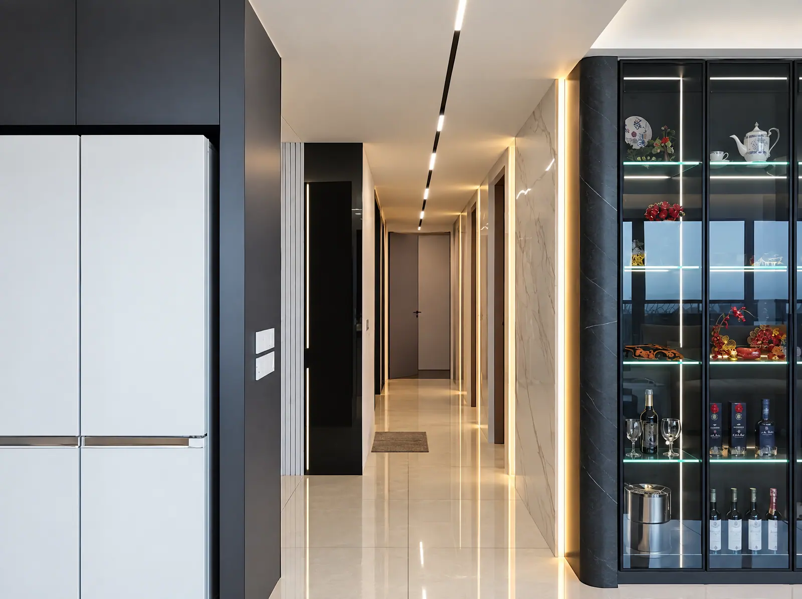 Real Cabchen corridor with a tall black-framed glass display cabinet and LED shelves